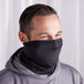 A man wearing a black Henry Segal neck gaiter as a face mask.