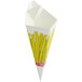 A white Carnival King paper cone with yellow french fries in it.
