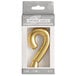 A package of gold number "9" birthday candles.