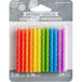 A package of Creative Converting rainbow colored spiral candles.