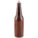 A brown wooden pepper mill in the shape of a beer bottle with a silver top.
