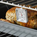 A CDN Multi-Mount Oven Thermometer in use.