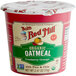 A red Bob's Red Mill container of organic cranberry orange oatmeal with a white lid.