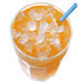 A glass of orange juice with Manitowoc ice and a straw.