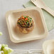 A TreeVive compostable wooden square plate with a mushroom, vegetables, and rice on it.