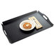 A black Cal-Mil room service tray with a pastry on it with a fork and knife.