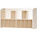 A white wall-mount wood diaper organizer with 11 compartments.
