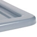 A close-up of a gray Winholt WHPL-8GY lug lid on a white surface.