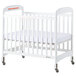 A white Foundations Serenity wood crib with adjustable mattress board.