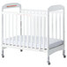 A white Foundations Serenity wood crib with adjustable mattress board and clearview sides.