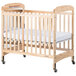 Foundations Serenity wooden crib with adjustable mattress board and wheels.