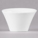A white Arcoroc Ludico deep bowl with a small rim on a grey surface.