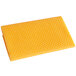 A yellow towel with an orange pattern on it.