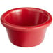 A close-up of a red Acopa melamine ramekin with a white background.