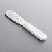 A Choice stainless steel sandwich spreader with a white handle.