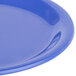A close-up of a blue Carlisle Sierrus melamine pie plate with a narrow rim.