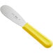 A Choice stainless steel sandwich spreader with a yellow handle.