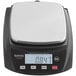 A black and white Galaxy PC22 digital portion scale on a counter.
