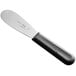 A Choice sandwich spreader with a black handle and scalloped blade.