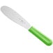 A white sandwich spreader with a neon green handle.
