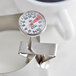 A CDN ProAccurate frothing thermometer on a white surface.