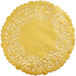 A gold doily with a lace pattern on it.