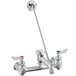 A silver Waterloo wall-mounted mop sink faucet with two long handles.