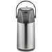 An Acopa stainless steel airpot with black accents and a push button lid.