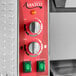 An Avantco vertical commercial bun toaster with red and silver dials.