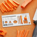 A Mercer Rules Mini reference tool with a knife and carrots on a cutting board.
