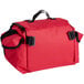 A red duffel bag with black straps.