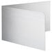 A white rectangular metal plate with curved edges and holes in it.