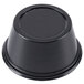 A Dart black plastic souffle cup with a round lid.