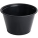 A black plastic Dart souffle container with a lid.