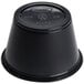 A black Dart plastic souffle container with a lid.