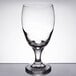 A clear Libbey tall drinking glass with a small rim on top.