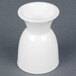 A white china egg cup with a white rim.