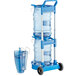 A blue and white San Jamar ice tote cart with two ice totes on it.