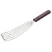 A Mercer Culinary Hell's Handle fish/egg turner with a metal spatula and wooden handle.