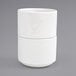 A stack of Front of the House Monaco bright white round porcelain ramekins.