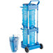 A San Jamar blue polypropylene ice tote with a handle and two ice totes.