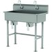 An Advance Tabco stainless steel multi-station hand sink with tubular legs and two knee-operated faucets.