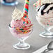 A couple of Acopa dessert dishes with ice cream and colorful sprinkles.