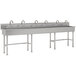 A long rectangular stainless steel Advance Tabco utility sink with three faucets on the side.