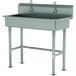 An Advance Tabco stainless steel ADA multi-station hand sink with tubular legs and two electronic faucets.