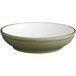 An Acopa Embers moss green stoneware bowl with a white rim.