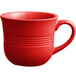 A close-up of an Acopa Capri Passion Fruit Red coffee cup with a handle.