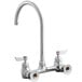 A silver Waterloo wall mount faucet with knobs.