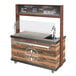 A wooden and glass Astra Rustic Espresso Machine Cart with a chalkboard on the counter.
