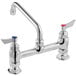 A silver Waterloo deck-mounted faucet with 8" swing nozzle and two handles with red and blue accents.